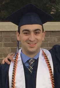 Mark Esposito in graduation gown.